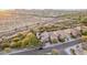 An aerial view of a well-planned community featuring many homes, desert landscaping, and desert mountain views at 21602 N 36Th St, Phoenix, AZ 85050