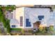 Aerial view of a landscaped backyard with pavers, artificial grass, and solar panels on the roof at 21602 N 36Th St, Phoenix, AZ 85050