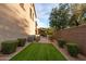 Green grass and low-maintenance backyard design, with easy access for year-round enjoyment at 21602 N 36Th St, Phoenix, AZ 85050