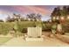 Lush backyard with water feature and mature landscaping at sunset at 21602 N 36Th St, Phoenix, AZ 85050