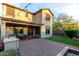 Inviting backyard with covered patio, built-in BBQ, lush grass, and charming pavers, perfect for outdoor entertaining at 21602 N 36Th St, Phoenix, AZ 85050