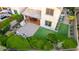 The backyard area offers pavers, an outdoor kitchen, manicured landscaping, and artificial turf at 21602 N 36Th St, Phoenix, AZ 85050