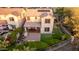 Aerial view of the backyard, showcasing an outdoor kitchen, garden, patio with pavers, and turf at 21602 N 36Th St, Phoenix, AZ 85050