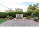 Secluded backyard featuring lush greenery, a charming water feature, and a paved patio perfect for tranquil outdoor living at 21602 N 36Th St, Phoenix, AZ 85050