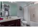 Well-lit bathroom with a granite countertop, vanity with drawers, and shower at 21602 N 36Th St, Phoenix, AZ 85050