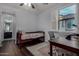 Comfortable bedroom with hardwood floor, desk, and view to the ensuite bathroom at 21602 N 36Th St, Phoenix, AZ 85050