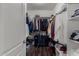 Organized walk-in closet with wood floor and white shelving offers plenty of storage space at 21602 N 36Th St, Phoenix, AZ 85050