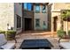 Secluded courtyard featuring vibrant greenery, comfortable seating, and a modern fire pit at 21602 N 36Th St, Phoenix, AZ 85050