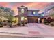 Inviting two-story home featuring a well-manicured lawn and attached two-car garage at 21602 N 36Th St, Phoenix, AZ 85050