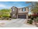 Charming two-story home showcasing a well-kept yard and an attached two-car garage at 21602 N 36Th St, Phoenix, AZ 85050