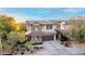 Charming two-story home boasts a landscaped front yard, desert landscaping, and a two-car garage at 21602 N 36Th St, Phoenix, AZ 85050