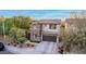 Stunning two-story home with well-manicured lawn, complemented by a spacious driveway and attached two-car garage at 21602 N 36Th St, Phoenix, AZ 85050