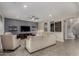 Bright living room with comfortable seating, ceiling fan, and recessed lighting at 21602 N 36Th St, Phoenix, AZ 85050