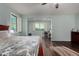 Bright main bedroom features wood floors, neutral walls, and an adjacent office area with natural light at 21602 N 36Th St, Phoenix, AZ 85050