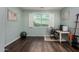 Comfortable office area with hardwood floors, a window with shutters, a desk, and an exercise ball at 21602 N 36Th St, Phoenix, AZ 85050