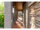 Charming walkway leading to a secure gate, framed by textured pillars and lush landscaping at 21602 N 36Th St, Phoenix, AZ 85050
