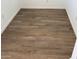 Stylish new flooring featuring light wood-look planks, clean white baseboards, and bright neutral walls at 22368 W Monona Ln, Surprise, AZ 85387