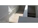 Carpeted staircase with white walls and handrail, leading to the upper level of the house at 22368 W Monona Ln, Surprise, AZ 85387
