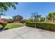 Spacious backyard with a basketball court, manicured hedges, and well-maintained lawn at 2257 E Redwood Ct, Chandler, AZ 85286