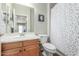 Simple bathroom featuring a vanity with a sink, a toilet, and a shower at 2257 E Redwood Ct, Chandler, AZ 85286