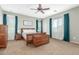 Inviting bedroom with soft carpet, a comfortable bed, and natural light filtering through sheer curtains at 2257 E Redwood Ct, Chandler, AZ 85286