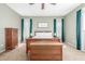 Cozy bedroom features soft carpet, a comfortable bed, and natural light from the windows with curtains at 2257 E Redwood Ct, Chandler, AZ 85286