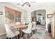 Well-lit dining room featuring a wood table, six chairs, and an arched doorway leading to another room at 2257 E Redwood Ct, Chandler, AZ 85286