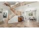 Spacious foyer with high ceilings, staircase with wooden railing, and view into the dining room at 2257 E Redwood Ct, Chandler, AZ 85286