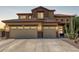 Inviting two-story home featuring a spacious three-car garage and drought-resistant landscaping at 2257 E Redwood Ct, Chandler, AZ 85286