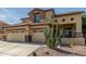 Inviting two-story home featuring a spacious three-car garage and desert landscaping at 2257 E Redwood Ct, Chandler, AZ 85286