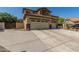 Charming two-story home featuring a spacious three-car garage and desert landscaping at 2257 E Redwood Ct, Chandler, AZ 85286
