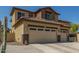 Charming two-story home featuring a spacious three-car garage and desert landscaping at 2257 E Redwood Ct, Chandler, AZ 85286