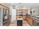 Bright kitchen features stainless steel appliances, wood cabinets, and tile flooring at 2257 E Redwood Ct, Chandler, AZ 85286