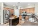 Bright kitchen features stainless steel appliances, wood cabinets, and tile flooring at 2257 E Redwood Ct, Chandler, AZ 85286