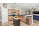 Bright kitchen features stainless steel appliances, wood cabinets, and tile flooring at 2257 E Redwood Ct, Chandler, AZ 85286