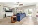 Comfortable living room with large television and plush blue seating at 2257 E Redwood Ct, Chandler, AZ 85286