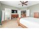 Relaxing main bedroom with a large bed, TV, and an en-suite bathroom with a glass-enclosed shower at 2257 E Redwood Ct, Chandler, AZ 85286