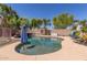 Inviting backyard pool area with a slide, palm trees, and ample space for relaxation at 2257 E Redwood Ct, Chandler, AZ 85286