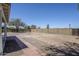 Spacious backyard featuring a gravel area, covered patio, and mature trees at 2338 E Folley St, Chandler, AZ 85225