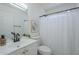 Bathroom featuring modern black hardware, framed art, and a shower with curtain at 2338 E Folley St, Chandler, AZ 85225