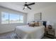 Cozy bedroom featuring a queen sized bed, neutral walls, and a large window at 2338 E Folley St, Chandler, AZ 85225