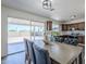 Dining area next to the kitchen with wood-look flooring and sliding door access to the backyard at 2338 E Folley St, Chandler, AZ 85225