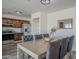 Light filled dining area boasts wood floors and an open layout connected to the kitchen at 2338 E Folley St, Chandler, AZ 85225