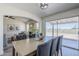 Inviting dining room with a sliding glass door and gray upholstered chairs surrounding a wooden table at 2338 E Folley St, Chandler, AZ 85225