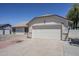 Single story home with a two-car garage and neutral stucco exterior at 2338 E Folley St, Chandler, AZ 85225
