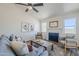 Cozy living room with vaulted ceilings, ceiling fan, fireplace and lots of natural light at 2338 E Folley St, Chandler, AZ 85225