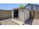 Backyard shed featuring durable metal construction and an easy access door at 2338 E Folley St, Chandler, AZ 85225