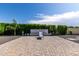 Beautiful backyard with privacy hedges, fountain, patio and lounge chair, perfect for relaxation at 25875 S 227Th Way, Queen Creek, AZ 85142