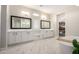 Bright bathroom featuring double sinks, white cabinets, and soaking tub at 25875 S 227Th Way, Queen Creek, AZ 85142