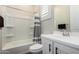 Bathroom featuring a shower-tub combo, white vanity, and modern fixtures at 25875 S 227Th Way, Queen Creek, AZ 85142